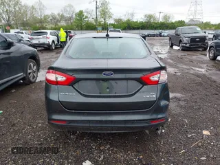 2015 Ford Fusion SE Hybrid with VIN 3FA6P0LU9FR184907, listed as a IAAI auction lot 42119737 with 153,255 mi miles and . Bid and sale history available at DreamBid. Image 17.