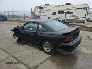 1997 Ford Mustang with VIN 1FALP4049VF136060, listed as a Copart auction lot 85389824 with 0 mi miles and Salvage Title. Bid and sale history available at carsss.com. Image 2.
