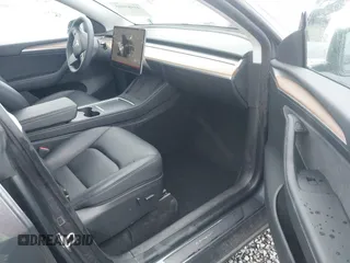 2023 Tesla Model Y Long Range with VIN 7SAYGAEE4PF871281, listed as a IAAI auction lot 41989805 with 15,501 mi miles. Bid and sale history available at carsss.com. Image 5.
