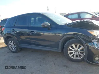 2016 Mazda CX-5 Touring with VIN JM3KE2CY6G0808992, listed as a IAAI auction lot 40969655 with 132,513 mi miles. Bid and sale history available at carsss.com. Image 13.