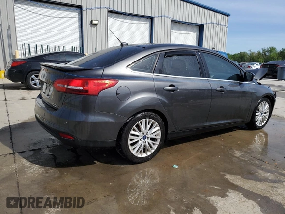 2015 Ford Focus Titanium с VIN 1FADP3J2XFL200668, выставлен на аукционе Copart как лот 54010865 с пробегом 138 459 миль миль и Списание • Salvage title. История ставок и продаж доступна на DreamBid. Изображение 3.