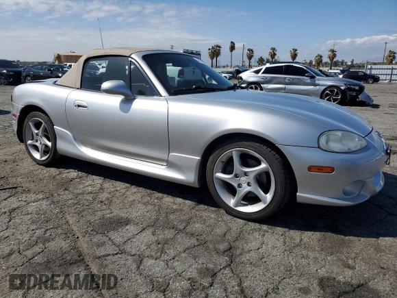 2003 Mazda MX-5 Miata Cloth z VIN JM1NB353430301685, wystawiony jako Copart lot #48756715 z przebiegiem 57 414 mil mil oraz Szkoda całkowita • Salvage title. Historia ofert i sprzedaży dostępna na DreamBid. Obrazek 4.