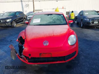 2014 Volkswagen Beetle 2.5L w/Sun with VIN 3VWJP7AT8EM629573, listed as a IAAI auction lot 41479054 with 73,950 mi miles and . Bid and sale history available at DreamBid. Image 12.
