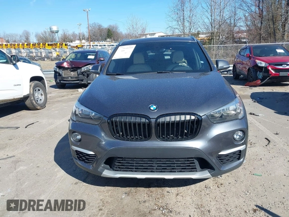 2018 BMW X1 xDrive28i z VIN WBXHT3C31J3H31737, wystawiony jako IAAI lot #41698670 z przebiegiem 68 017 mil mil oraz . Historia ofert i sprzedaży dostępna na DreamBid. Obrazek 13.