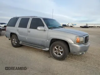 2000 GMC Denali z VIN 1GKEK63R9YR225073, wystawiony jako Copart lot #86819964 z przebiegiem 207 827 mil mil oraz Szkody całkowita. Historia ofert i sprzedaży dostępna na DreamBid. Obrazek 4.
