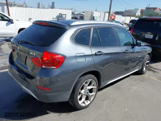 2014 BMW X1 xDrive28i with VIN WBAVL1C57EVY23722, listed as a IAAI auction lot 41839543 with 121,742 mi miles. Bid and sale history available at carsss.com. Image 4.