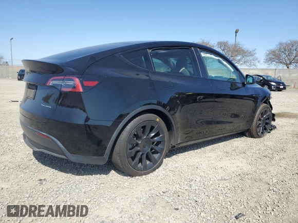 2023 Tesla Model Y Long Range with VIN 7SAYGAEE0PF642810, listed as a Copart auction lot 52181655 with 74,922 mi miles and Salvage Title. Bid and sale history available at DreamBid. Image 3.