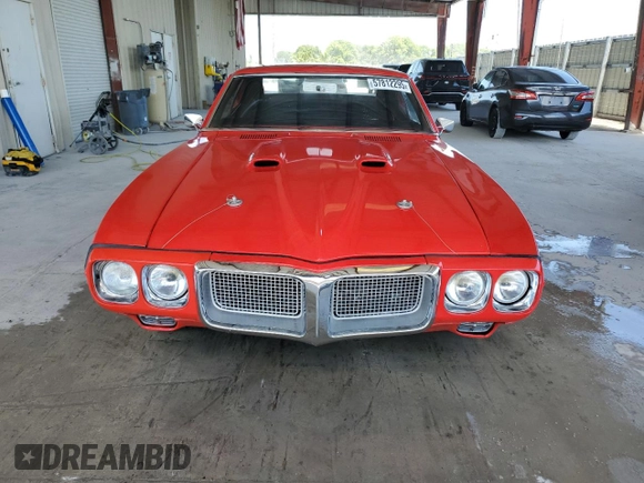 1969 Pontiac Firebird z VIN 223379ULL6573, wystawiony jako Copart lot #57812295 z przebiegiem 142 mil mil oraz Tytuł czysty. Historia ofert i sprzedaży dostępna na DreamBid. Obrazek 5.