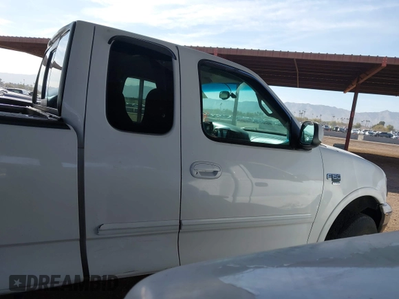 1999 Ford F-150 XL with VIN 2FTRX18L9XCA21004, listed as a IAAI auction lot 41616300 with 186,620 mi miles. Bid and sale history available at carsss.com. Image 13.
