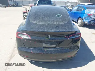 2020 Tesla Model 3 Standard Range Plus with VIN 5YJ3E1EAXLF614002, listed as a IAAI auction lot 41758898 with 42,363 mi miles and . Bid and sale history available at DreamBid. Image 16.