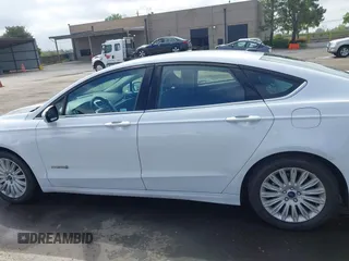 2016 Ford Fusion SE Hybrid with VIN 3FA6P0LU7GR397310, listed as a IAAI auction lot 42075891 with 124,879 mi miles. Bid and sale history available at carsss.com. Image 14.