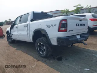 2022 Ram 1500 Rebel with VIN 1C6SRFLT5NN318494, listed as a IAAI auction lot 42413194 with 59,458 mi miles and . Bid and sale history available at DreamBid. Image 3.