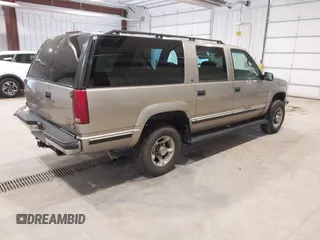 1999 GMC Suburban with VIN 3GKGK26J0XG537434, listed as a IAAI auction lot 41787267 with 180,439 mi miles. Bid and sale history available at carsss.com. Image 4.