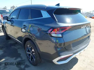 2023 Kia Sportage EX with VIN KNDPVCAG8P7019572, listed as a IAAI auction lot 42226335 with 68,583 mi miles and . Bid and sale history available at DreamBid. Image 3.