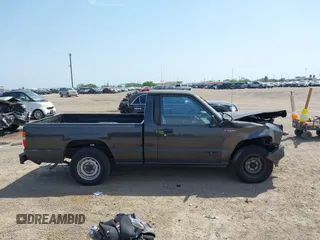 1992 Mitsubishi Mighty Max z VIN JA7FL24W9NP021503, wystawiony jako IAAI lot #41942559 z przebiegiem 162 088 mil mil oraz . Historia ofert i sprzedaży dostępna na DreamBid. Obrazek 13.