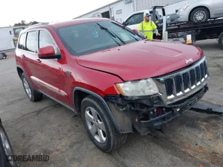 2011 Jeep Grand Cherokee Laredo with VIN 1J4RR4GT8BC636651, listed as a IAAI auction lot 41768944 with 200,160 mi miles. Bid and sale history available at carsss.com. Image 1.