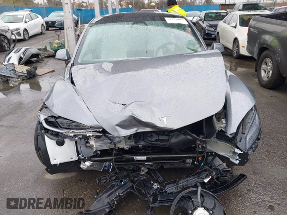 2025 Tesla Model 3 Long Range with VIN 5YJ3E1EA2SF885408, listed as a IAAI auction lot 41778498 with 1,566 mi miles and . Bid and sale history available at DreamBid. Image 12.
