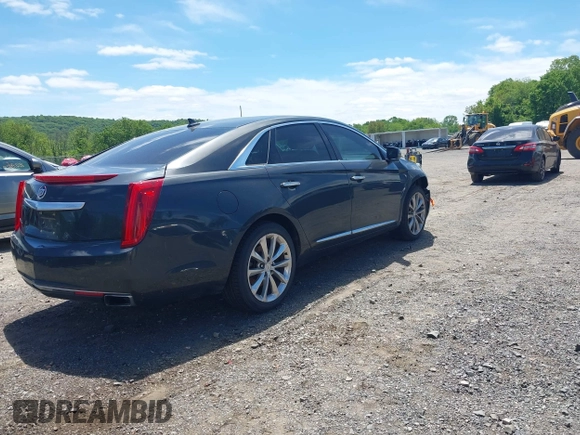 2013 Cadillac XTS Luxury z VIN 2G61R5S33D9101434, wystawiony jako IAAI lot #42290199 z przebiegiem 48 075 mil mil oraz . Historia ofert i sprzedaży dostępna na DreamBid. Obrazek 4.