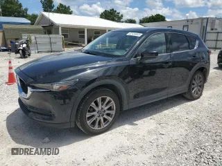 2019 Mazda CX-5 Grand Touring with VIN JM3KFBDM0K0638730, listed as a Copart auction lot 62426945 with 30,828 mi miles and Salvage title. Bid and sale history available at DreamBid. Image 1.