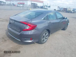 2020 Honda Civic LX with VIN 2HGFC2F65LH505932, listed as a IAAI auction lot 40046863 with 59,768 mi miles and . Bid and sale history available at DreamBid. Image 4.