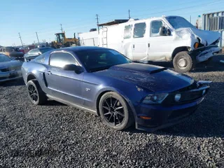 2010 Ford Mustang GT with VIN 1ZVBP8CH8A5124359, listed as a IAAI auction lot 41677371 with 154,190 mi miles. Bid and sale history available at carsss.com. Image 1.