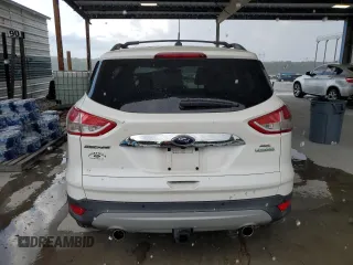 2013 Ford Escape SEL с VIN 1FMCU0H91DUB90163, выставлен на аукционе Copart как лот 64091785 с пробегом 156 038 миль миль и Списание • Salvage title. История ставок и продаж доступна на DreamBid. Изображение 6.