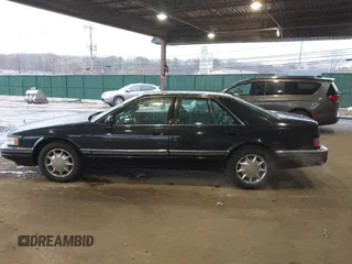 1997 Cadillac Seville Luxury SLS with VIN 1G6KS52YXVU816736, listed as a IAAI auction lot 41854220 with 107,091 mi miles. Bid and sale history available at carsss.com. Image 14.