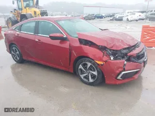 2020 Honda Civic Sedan LX with VIN 19XFC2F66LE005563, listed as a IAAI auction lot 41558659 with 60,248 mi miles. Bid and sale history available at carsss.com. Image 1.