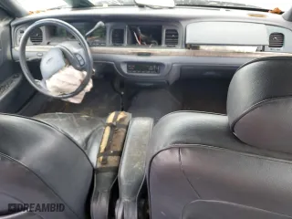 1999 Ford Crown Victoria LX with VIN 2FAFP74WXXX137154, listed as a Copart auction lot 71418784 with 97,589 mi miles and Salvage Title. Bid and sale history available at carsss.com. Image 8.
