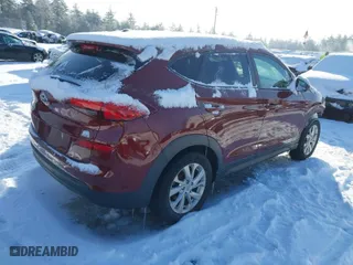 2019 Hyundai Tucson SE with VIN KM8J2CA44KU981393, listed as a IAAI auction lot 41455334 with 98,318 mi miles. Bid and sale history available at carsss.com. Image 4.