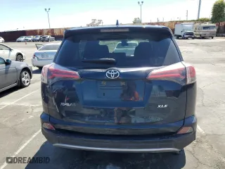 2018 Toyota RAV4 XLE with VIN JTMWFREV9JJ745584, listed as a Copart auction lot 51451885 with 114,985 mi miles and Salvage Title. Bid and sale history available at carsss.com. Image 6.