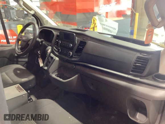 2020 Ford Transit Cargo with VIN 1FTBR1CG6LKB75357, listed as a IAAI auction lot 42243287 with 100,958 mi miles and . Bid and sale history available at DreamBid. Image 39.