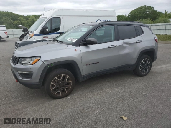 2021 Jeep Compass Trailhawk z VIN 3C4NJDDBXMT565063, wystawiony jako Copart lot #57620595 z przebiegiem 125 956 mil mil oraz Czysty tytuł • Clean title. Historia ofert i sprzedaży dostępna na DreamBid. Obrazek 1.