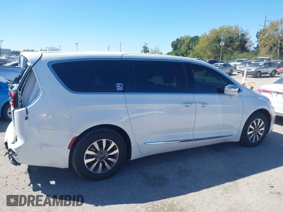 2022 Chrysler Pacifica Hybrid Limited with VIN 2C4RC1S74NR112960, listed as a IAAI auction lot 41584818 with 22,040 mi miles and . Bid and sale history available at DreamBid. Image 13.