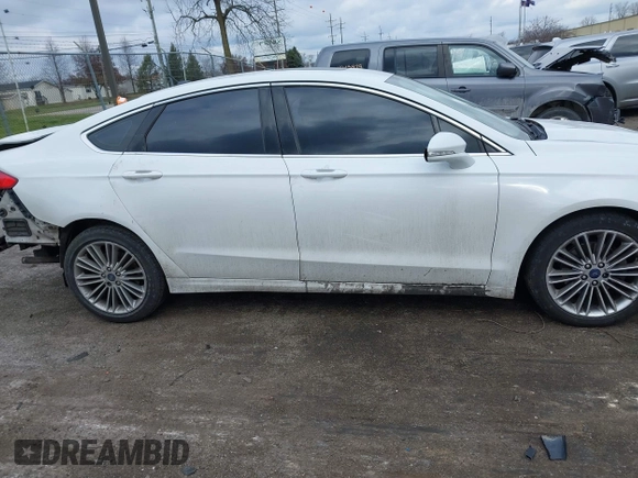 2015 Ford Fusion SE with VIN 3FA6P0H9XFR181132, listed as a IAAI auction lot 41075635 with 216,089 mi miles and . Bid and sale history available at DreamBid. Image 14.