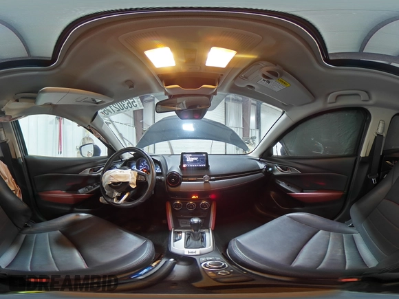 2018 Mazda CX-3 Touring z VIN JM1DKFC75J0301307, wystawiony jako Copart lot #56302175 z przebiegiem 107 676 mil mil oraz Szkoda całkowita • Salvage title. Historia ofert i sprzedaży dostępna na DreamBid. Obrazek 14.