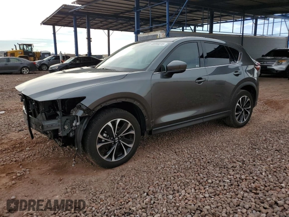 2022 Mazda CX-5 2.5 S Premium Package with VIN JM3KFBDM8N0590642, listed as a Copart auction lot 48996015 with 12,654 mi miles and Salvage Title. Bid and sale history available at carsss.com. Image 1.