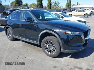 2021 Mazda CX-5 Touring with VIN JM3KFACM2M0339349, listed as a IAAI auction lot 41651005 with 53,792 mi miles. Bid and sale history available at carsss.com. Image 1.
