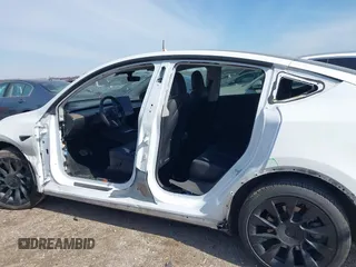 2022 Tesla Model Y Long Range with VIN 7SAYGDEE4NF428434, listed as a IAAI auction lot 41578503 with 35,460 mi miles and . Bid and sale history available at DreamBid. Image 14.