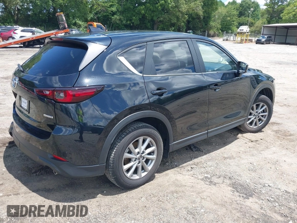2023 Mazda CX-5 S Carbon Edition z VIN JM3KFBCMXP0201665, wystawiony jako IAAI lot #39965378 z przebiegiem 29 105 mil mil oraz . Historia ofert i sprzedaży dostępna na DreamBid. Obrazek 4.