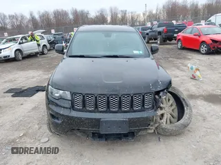 2019 Jeep Grand Cherokee Laredo E with VIN 1C4RJFAGXKC674676, listed as a IAAI auction lot 41942125 with 72,151 mi miles. Bid and sale history available at carsss.com. Image 13.
