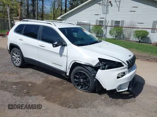 2015 Jeep Cherokee Latitude with VIN 1C4PJLCS3FW670254, listed as a IAAI auction lot 42060659 with 164,291 mi miles. Bid and sale history available at carsss.com. Image 1.