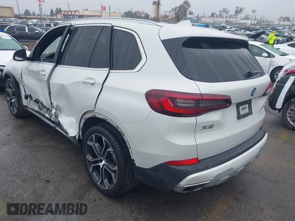 2021 BMW X5 sDrive40i with VIN 5UXCR4C03M9F24817, listed as a IAAI auction lot 41512172 with 54,867 mi miles. Bid and sale history available at carsss.com. Image 3.