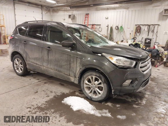 2018 Ford Escape SE with VIN 1FMCU9GD8JUA53114, listed as a IAAI auction lot 41592808 with 167,659 mi miles. Bid and sale history available at carsss.com. Image 1.