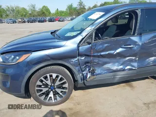 2020 Ford Escape SE Sport Hybrid with VIN 1FMCU9BZ6LUC38008, listed as a IAAI auction lot 42143784 with 81,804 mi miles and . Bid and sale history available at DreamBid. Image 6.