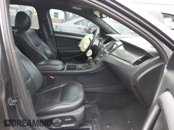 2015 Ford Taurus SEL z VIN 1FAHP2E81FG163058, wystawiony jako IAAI lot #42279778 z przebiegiem 127 957 mil mil oraz . Historia ofert i sprzedaży dostępna na DreamBid. Obrazek 5.