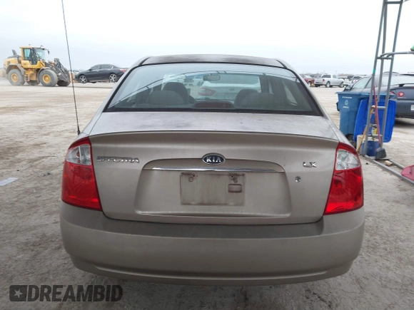 2004 Kia Spectra LX with VIN KNAFE121245064294, listed as a IAAI auction lot 41424241 with 110,136 mi miles. Bid and sale history available at carsss.com. Image 16.