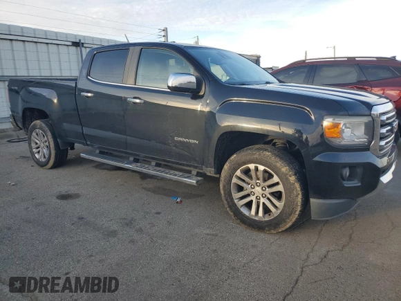 2015 GMC Canyon 4WD SLT z VIN 1GTG6CE34F1121540, wystawiony jako Copart lot #86190774 z przebiegiem 141 381 mil mil oraz Czysty tytuł • Clean title. Historia ofert i sprzedaży dostępna na DreamBid. Obrazek 4.