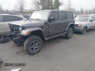 2021 Jeep Wrangler Unlimited Sahara z VIN 1C4JJXP68MW745098, wystawiony jako IAAI lot #41461092 z przebiegiem 36 410 mil mil oraz . Historia ofert i sprzedaży dostępna na DreamBid. Obrazek 2.