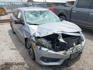 2016 Honda Civic EX-T with VIN 19XFC1F37GE013273, listed as a IAAI auction lot 42428081 with 142,802 mi miles and . Bid and sale history available at DreamBid. Image 1.